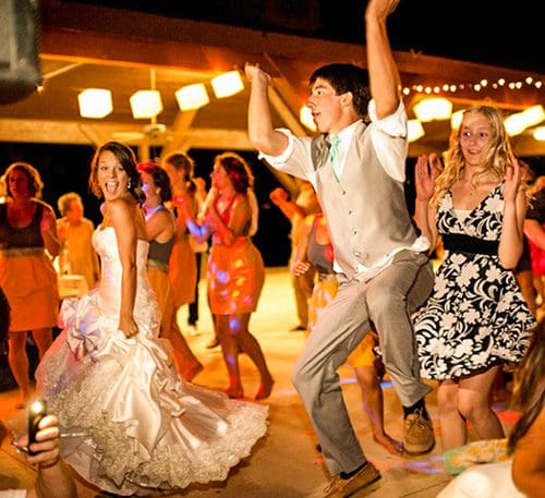 A bride and groom enjoying their own wedding.